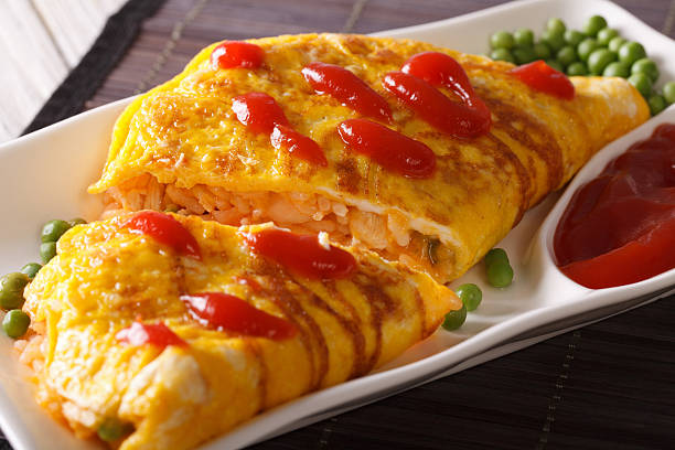 japanese omelet with rice omurice close-up on a plate. horizonta - hotizontal imagens e fotografias de stock