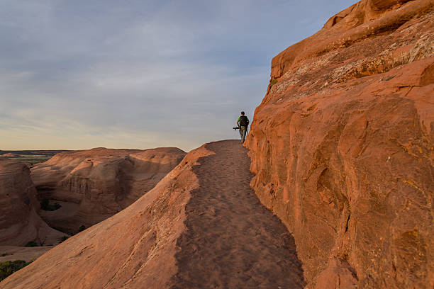 istock Photographer in action in the desert, Moab 615618338