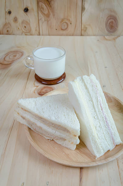 istock sandwich with milk on wood background 615618678