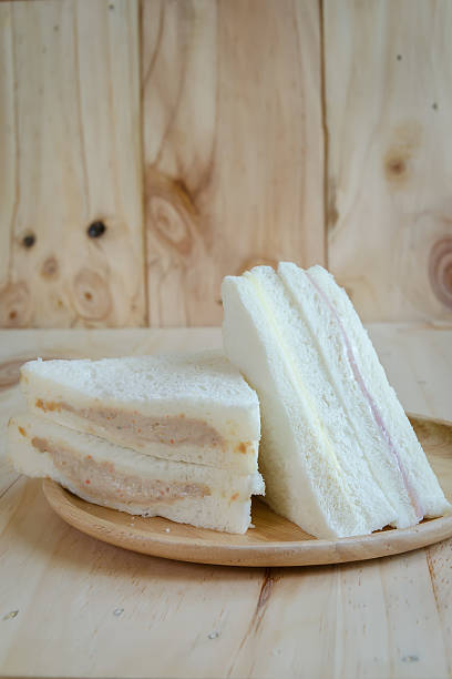 istock sandwich  on wood background 615618750