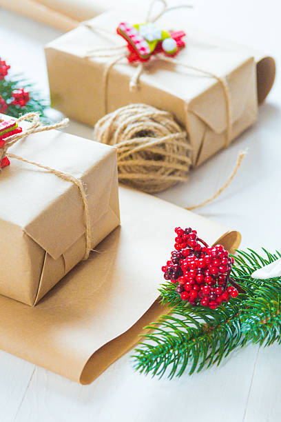 istock Christmas gift and a sprig of pine needles 615620426