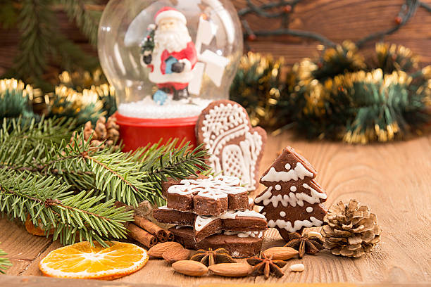 istock Christmas gingerbread cookies against background sphere with San 615621638