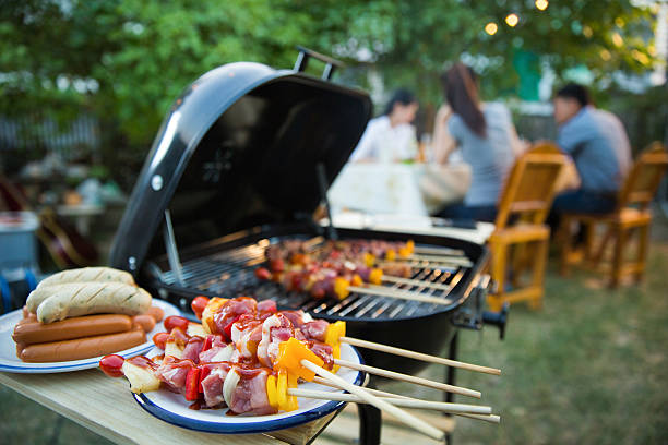 istock Dinner party, barbecue and roast pork at night 615622952