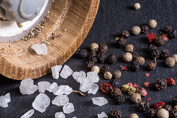 istock Pepper Grains, Sea Salt and Pepper Mill Background 615623076