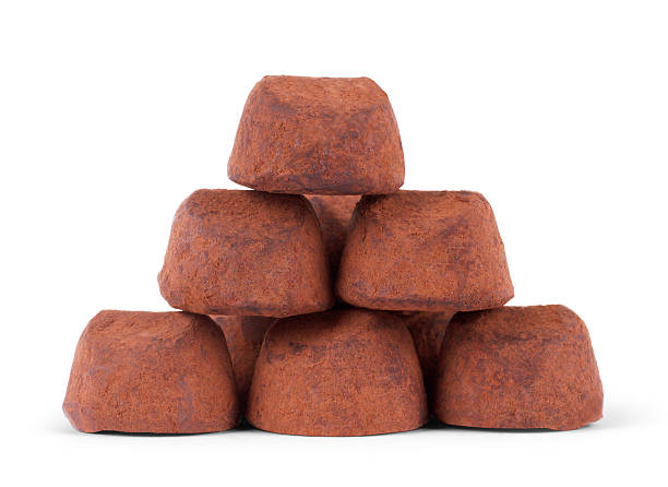 istock chocolate truffle isolated on white background 615623142