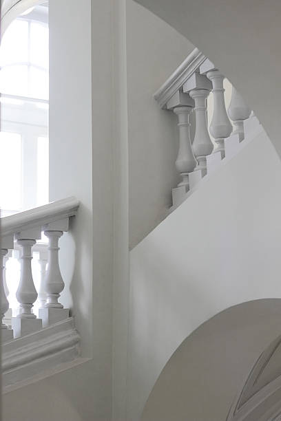 istock Baroque architecture. Sterile white arched interior with fragment of staircase. 615626888