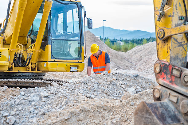istock Portrait of an Earth Digger Driver with blueprint in hand 615628752