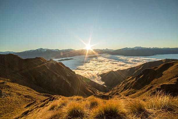 istock Sunset above the clouds, view from mountain peak 615628816