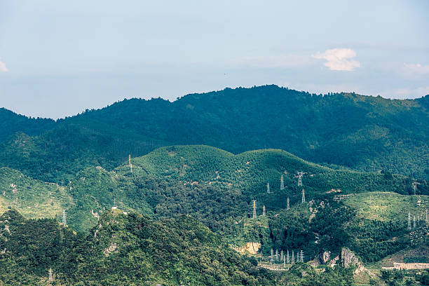 istock green mountain and power towers 615629760