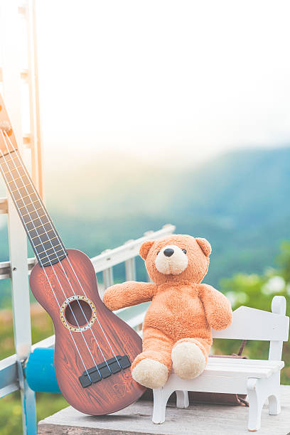 istock Music lover teddy bear relaxation nature background pastel colour 615631552