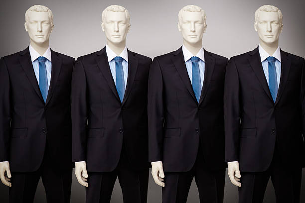 Business mannequin Image of mannequins in black suit standing in a row cloning photos stock pictures, royalty-free photos & images