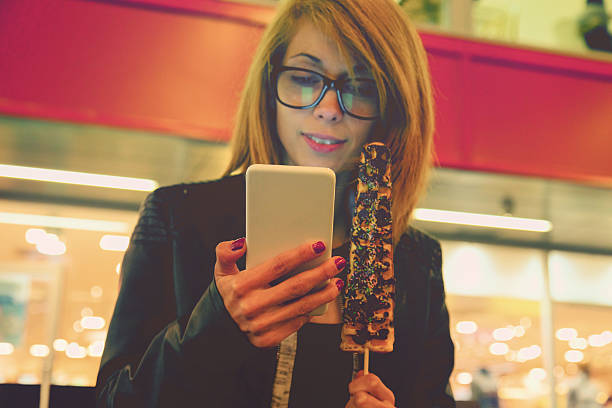 istock Woman using cellphone in urban surroundings. 615632786