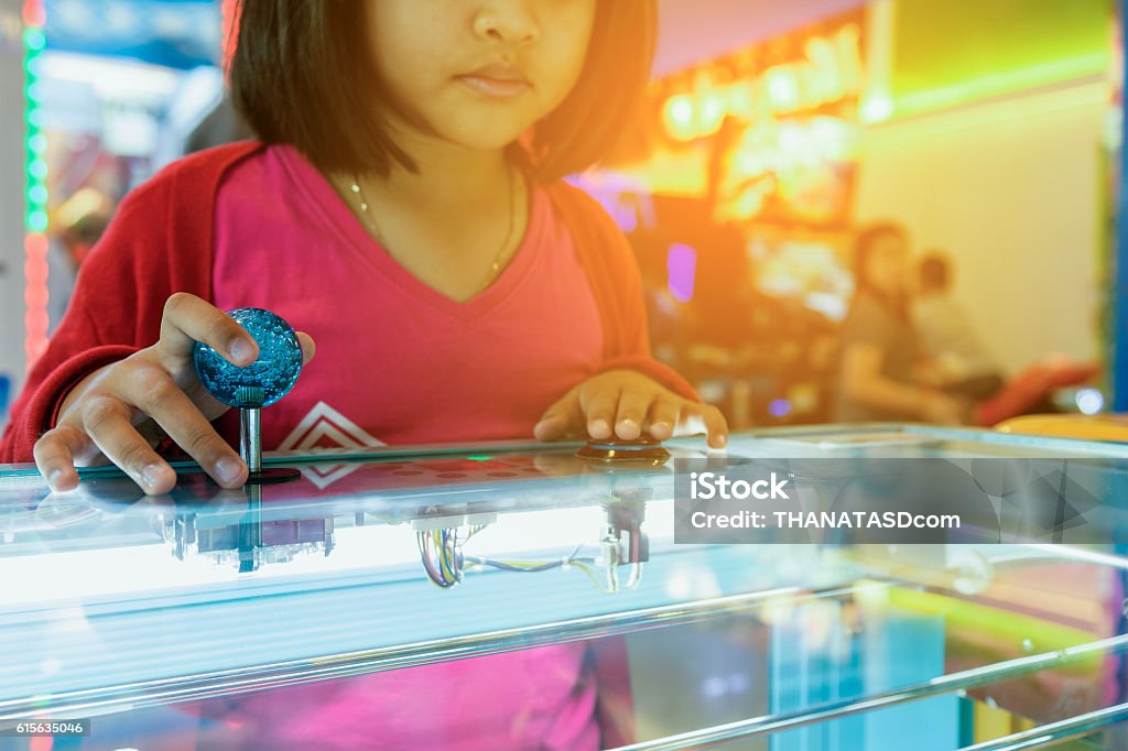 Close up hand control joystick of arcade,Vintage tone, Close up hand control joystick of arcade,Vintage tone,Close up Joystick of game player Amusement Arcade Stock Photo