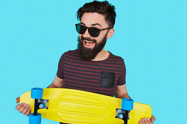 istock Young hipster man with a skateboard 615636458