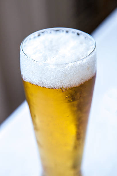 istock foamy head on a glass of beer 615637368