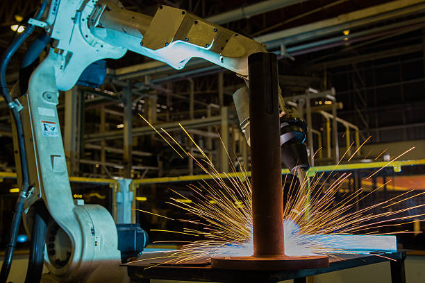 istock Robot welding part in automotive factory 615638538
