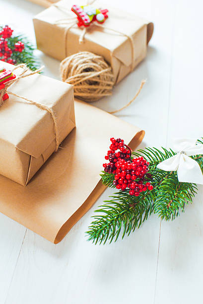 istock Christmas gift and a sprig of pine needles 615638910