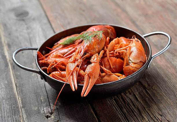 istock boiled crawfish in a plate  on a wooden background 615639436