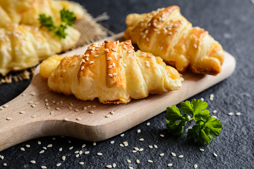Homemade savory croissants stuffed with Emmental cheese