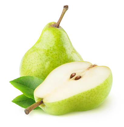 There is a pear cut in half, slices and a knife on a cutting board. Fruits on a plate. Minimal autumn concept