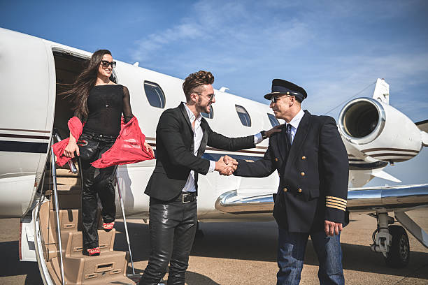 istock Male passenger shaking hands with pilot 615641170