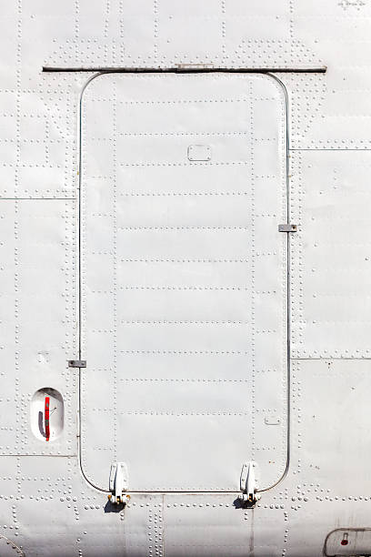 Old white painted aircraft fuselage close up.