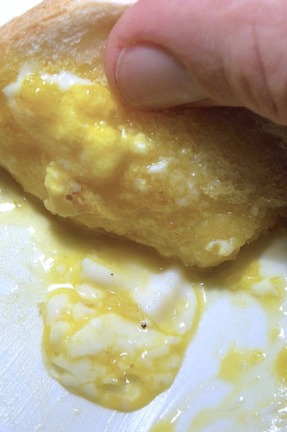 istock Sopping Up the Best Part of Dippy Eggs with Toast 615703054