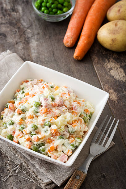 istock Traditional russian salad on wooden 615703066