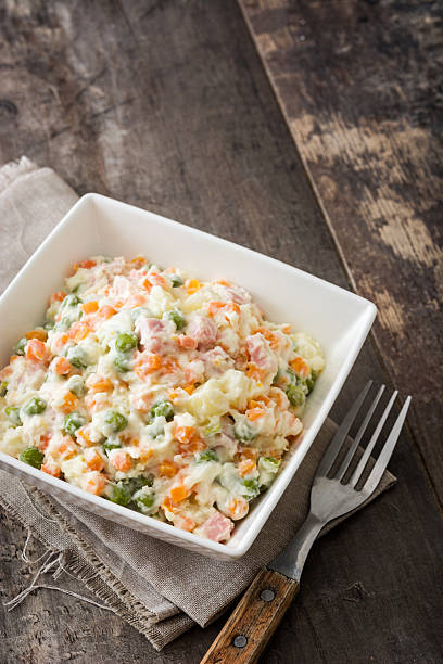 istock Traditional russian salad on wooden 615703156