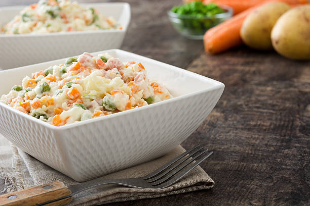 istock Traditional russian salad on wooden 615703366