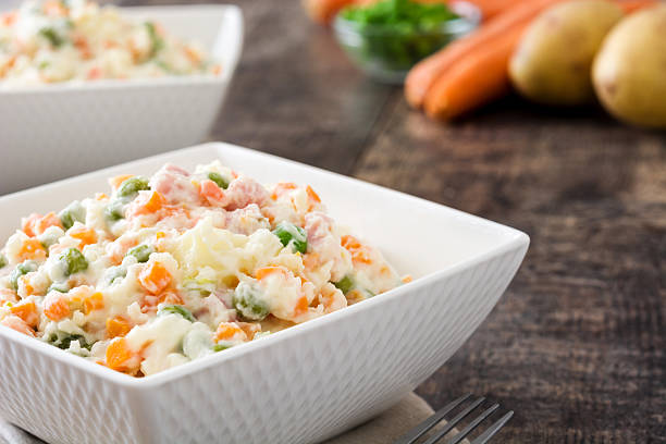 istock Traditional russian salad on wooden 615703452