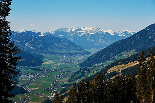 istock Green valley and snowy mountains 615703742