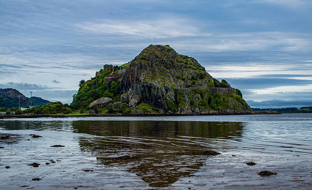 Dumbarton Castle Dumbarton Castle, captured from the shore of Levengrove park, close to where the River Leven meets the River Clyde. dumbarton castle stock pictures, royalty-free photos & images