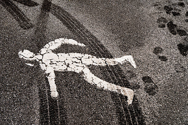 istock Painted pedestrian road symbol covered in tire tracks 615711042