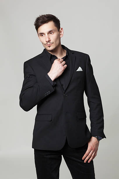 istock Studio portrait of handsome elegant young man in black clothes. 615712594