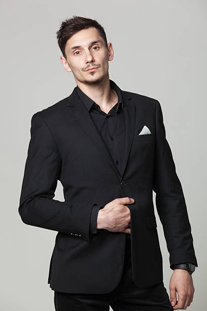 istock Studio portrait of handsome elegant young man in black clothes. 615712704