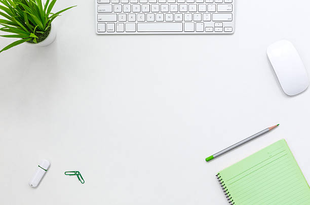 contemporary open space office white table with electronics and flower - mouse pad imagens e fotografias de stock