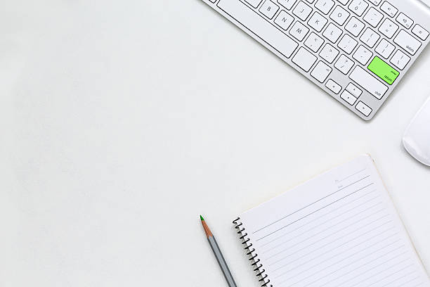 istock Modern Business Theme Paper and Computer on white Table 615715644