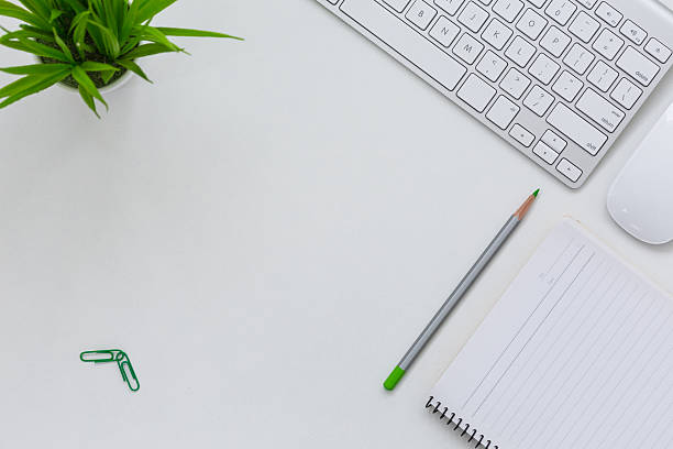 istock Cozy contemporary Business Theme on white Table with green Pencil 615715806