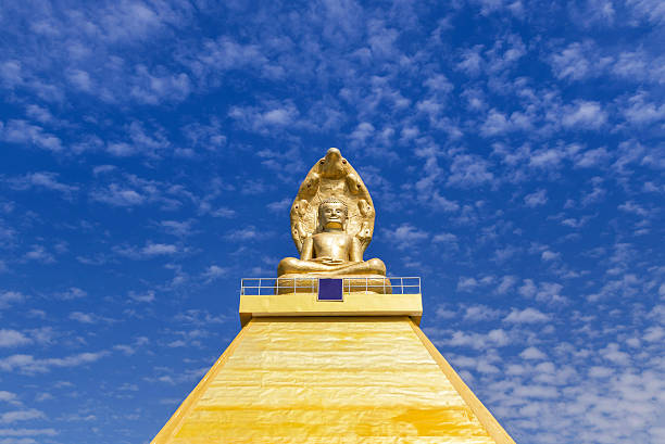 A golden buddha statue sits in peaceful meditation.*Note: Buddha has a clipping path.