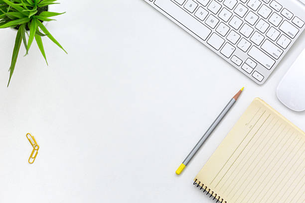 istock Modern working Place on White Office Desk with yellow 615716412