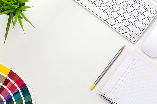 istock Workplace of professional Designer white Office Table with colour palette 615716648