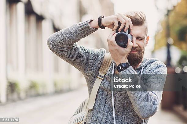 Young Man Photographer Looking At Camera Stock Photo - Download Image Now - Photographer, Camera - Photographic Equipment, Photographing