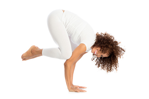 Beautiful woman doing yoga, isolated on white