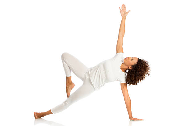 istock Beautiful woman doing yoga, isolated on white 615719312