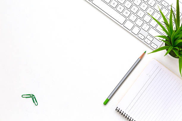 istock Modern white office desk flat lay business items and plant 615719702