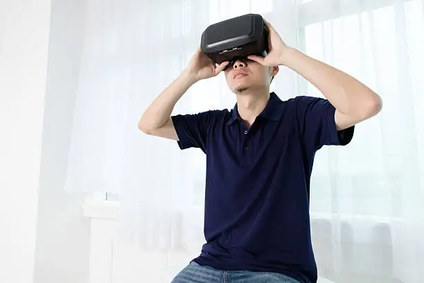 Businessman holding VR equipment