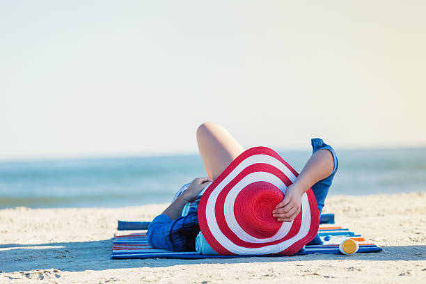 istock Peaceful woman relaxes on a beach vacation 615723722
