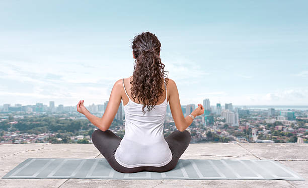 istock Yoga on the roof top 615724294