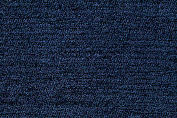 Navy blue background from soft textile material. Navy blue background from a soft textile material. sheathing fabric with natural texture. Cloth backdrop. carpet factory photos stock pictures, royalty-free photos & images